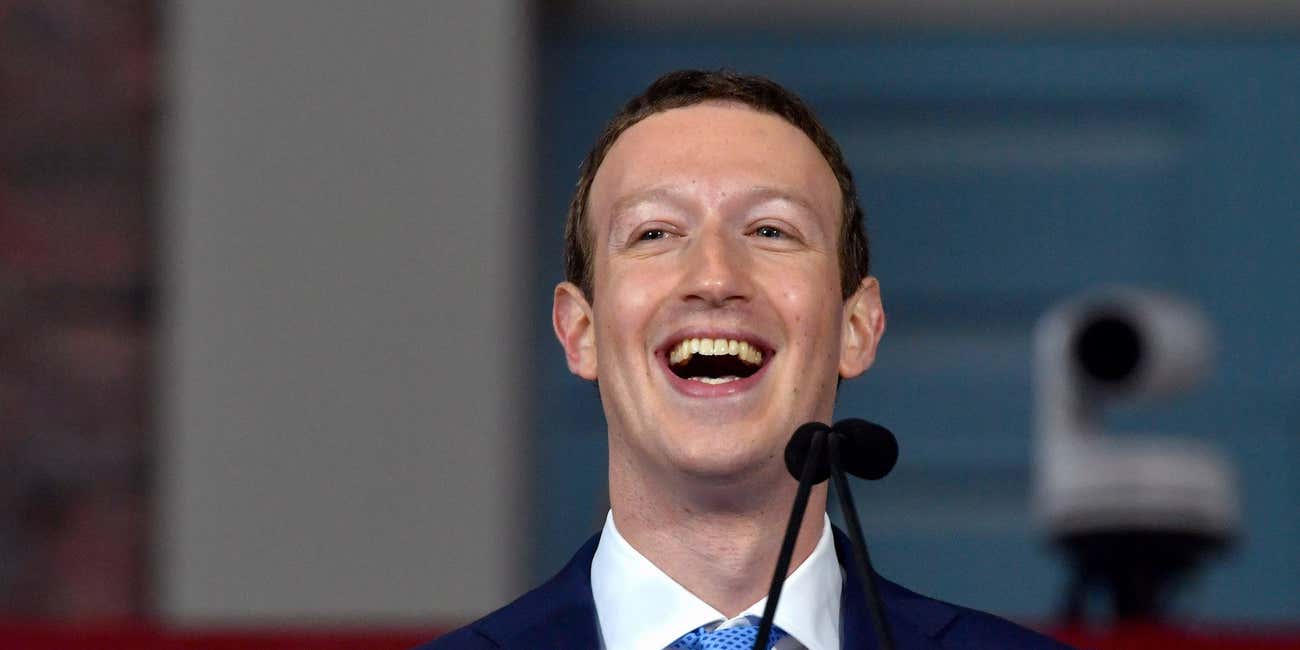 Mark Zuckerberg laughing.