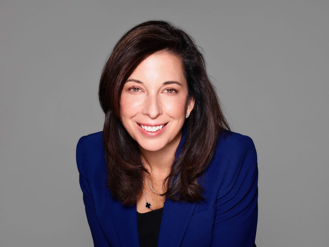 Janet Truncale headshot, wearing blue blazer